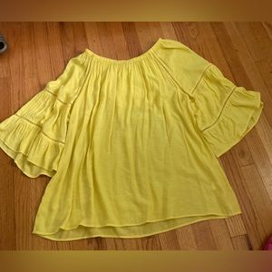 Cato’s yellow blouse